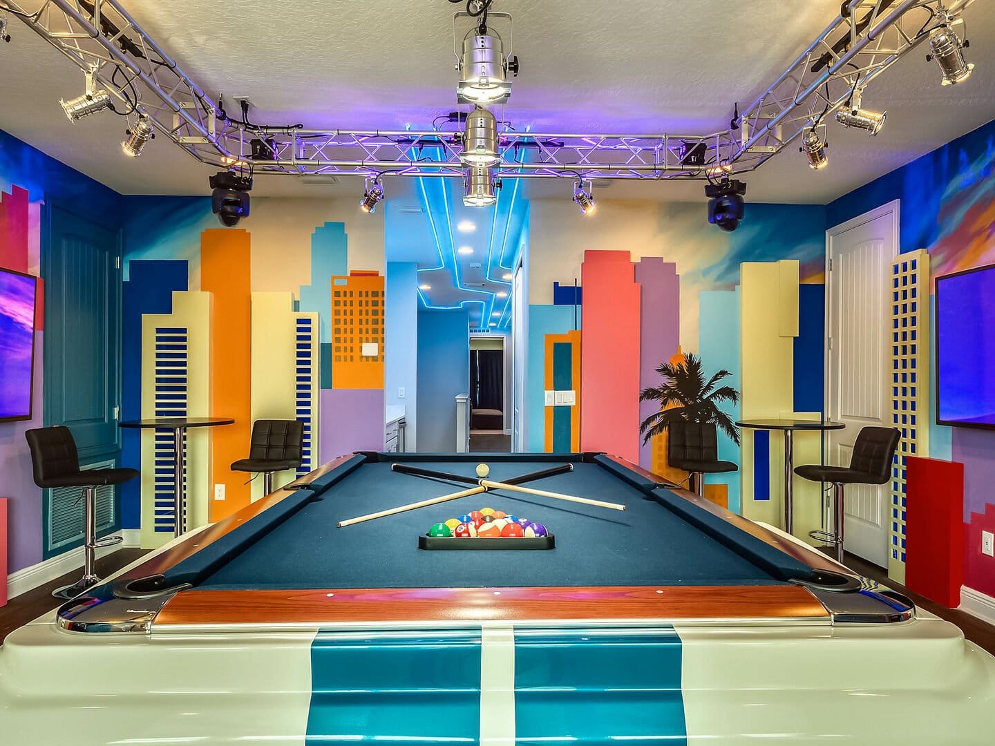 Colorful billiard room with city mural