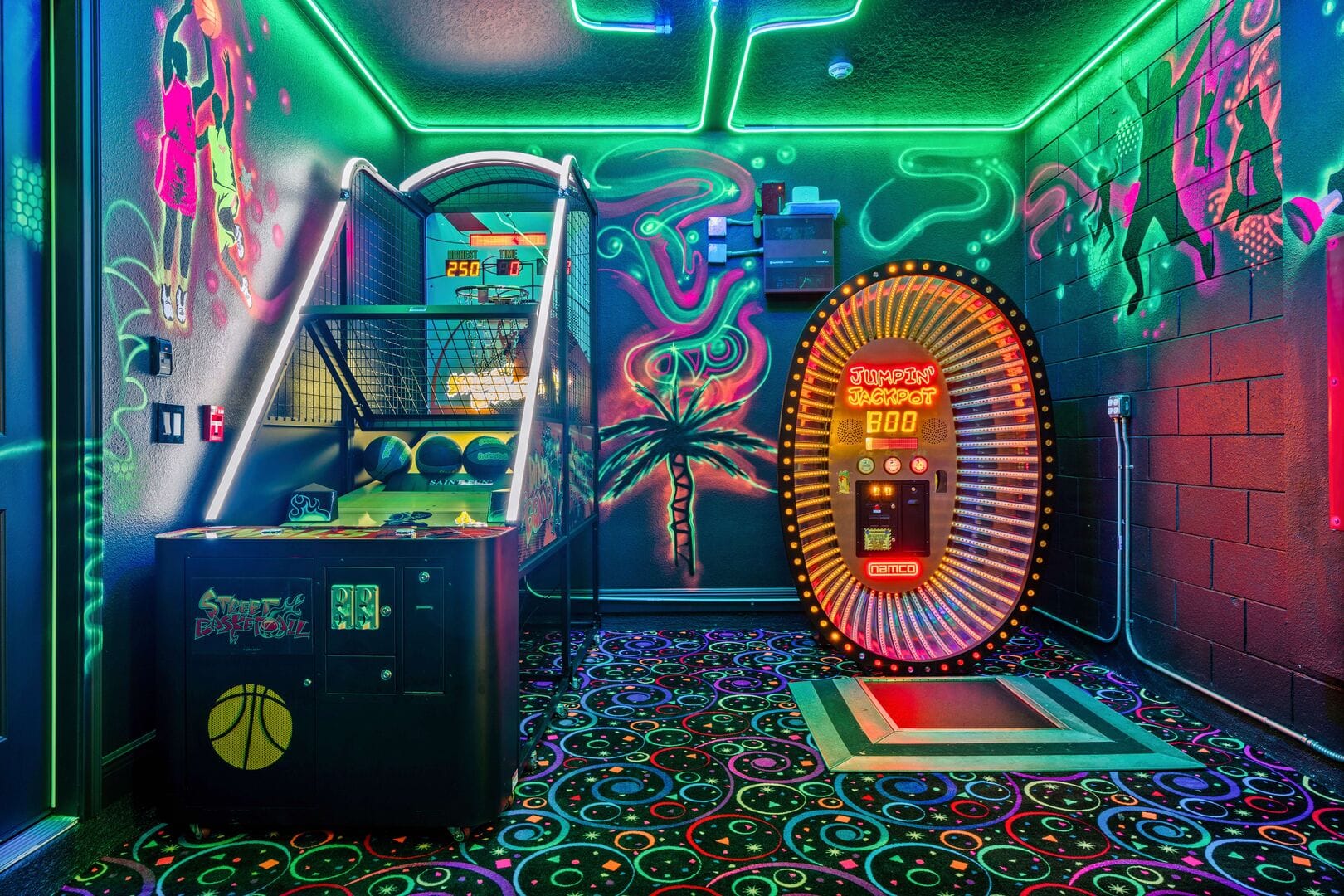 Neon-lit arcade with basketball game.