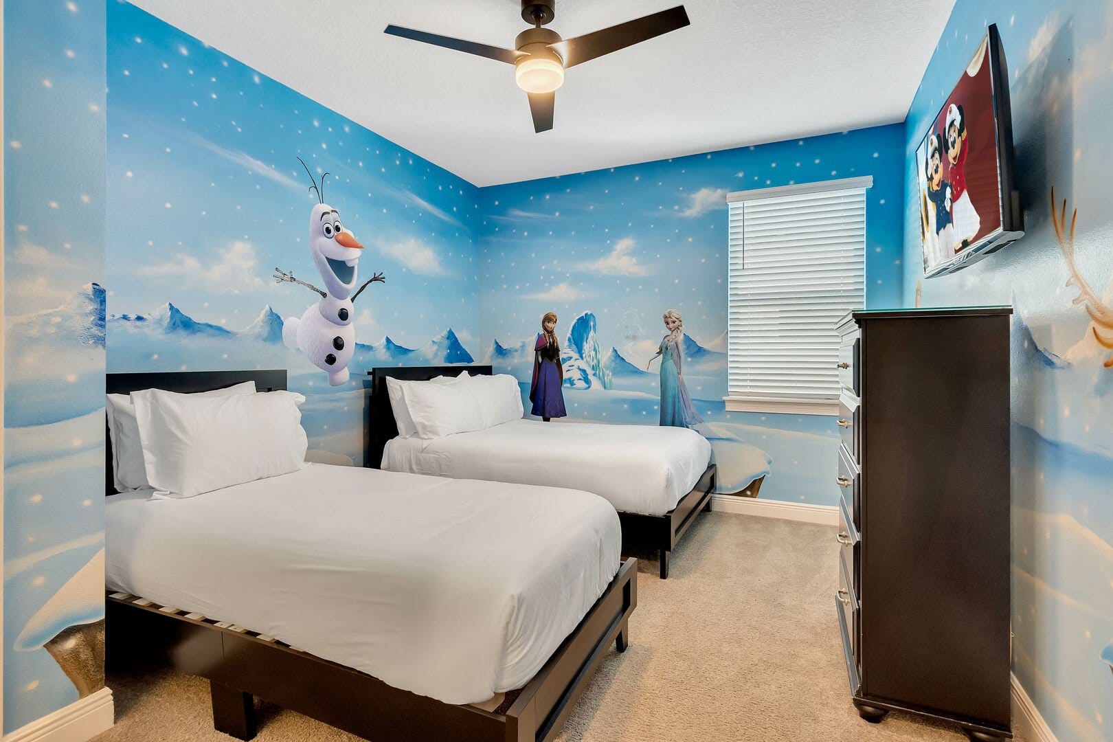 Frozen-themed bedroom with twin beds.