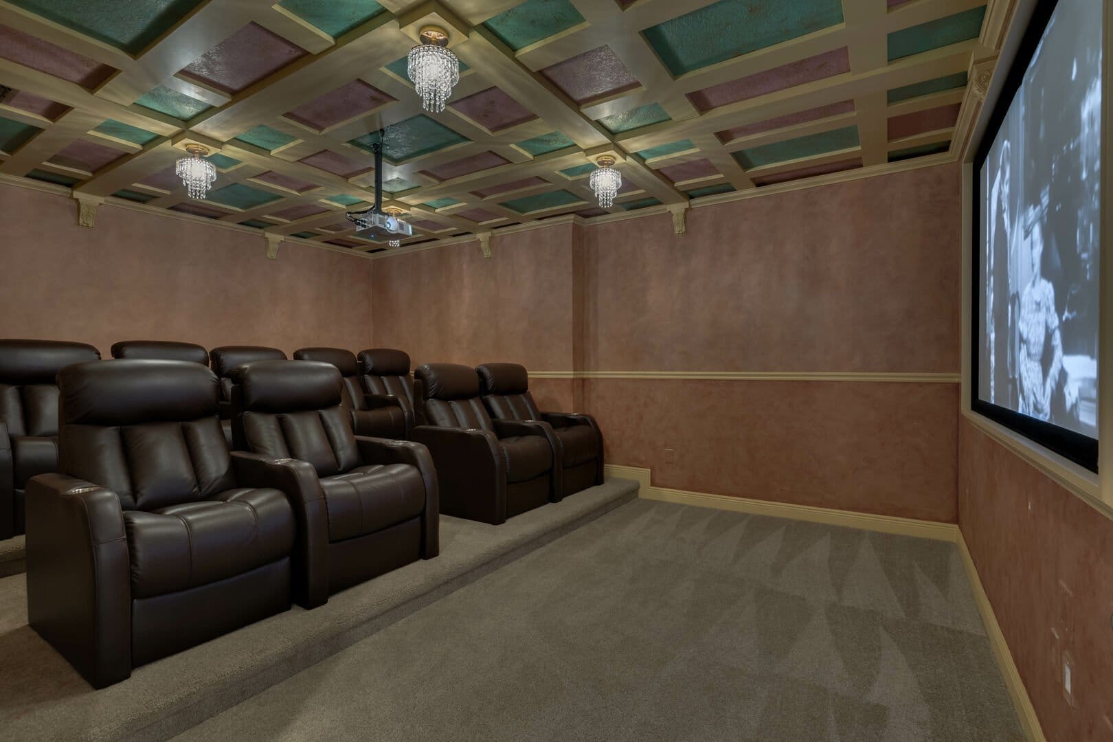 Home theater with leather recliners.