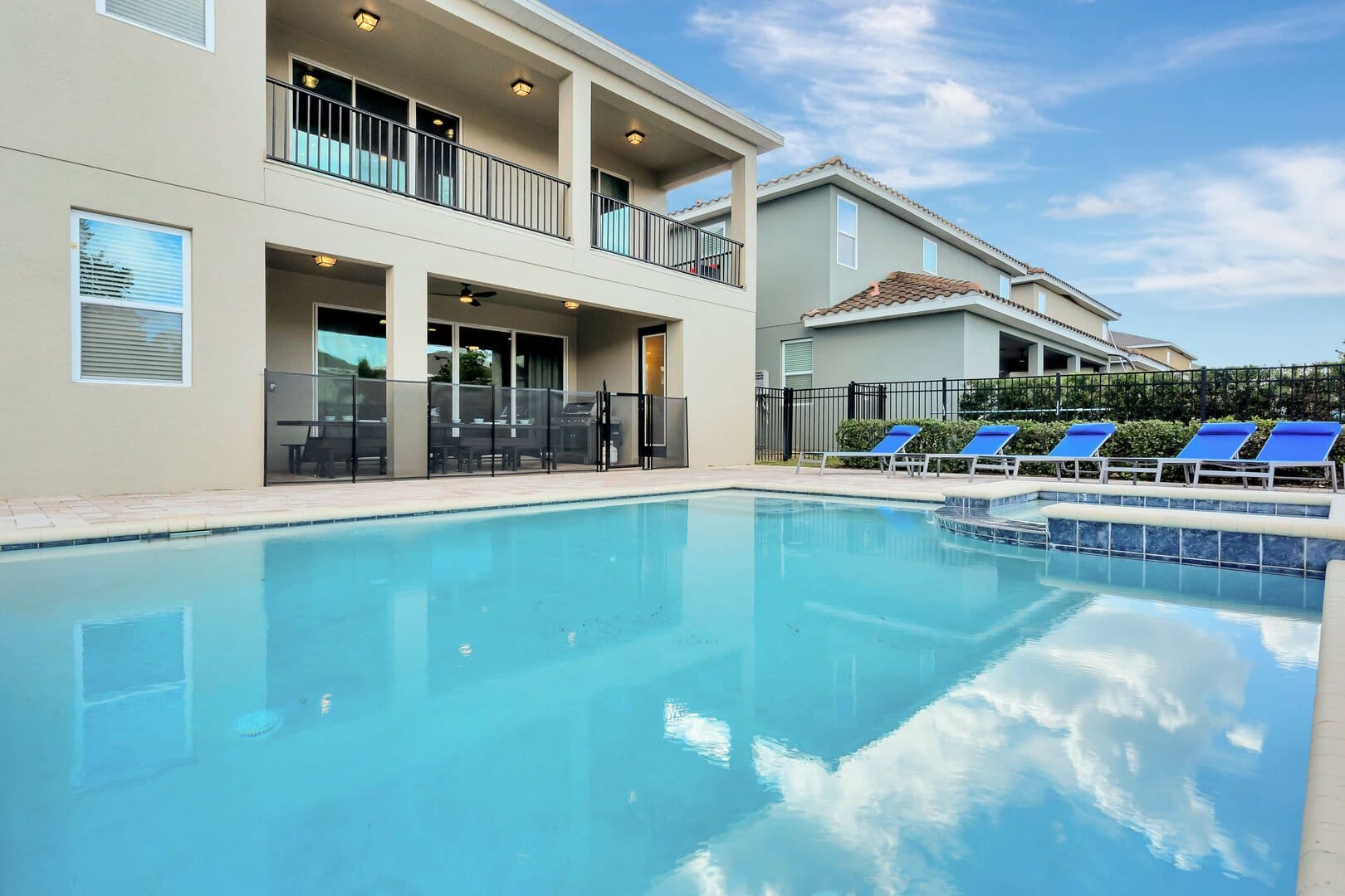 House with a backyard swimming pool.