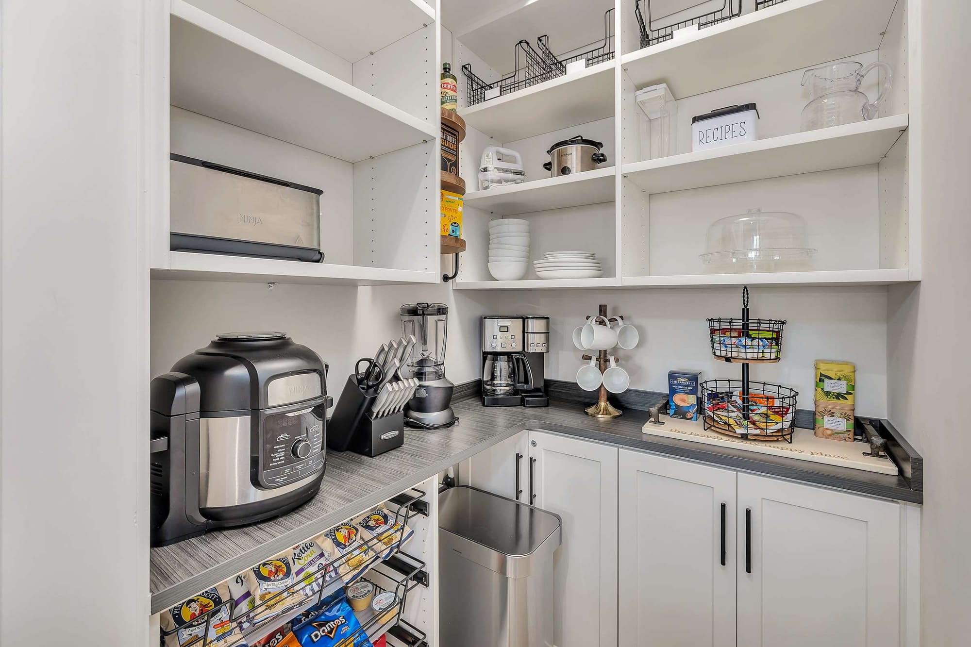 Organized kitchen pantry with appliances.