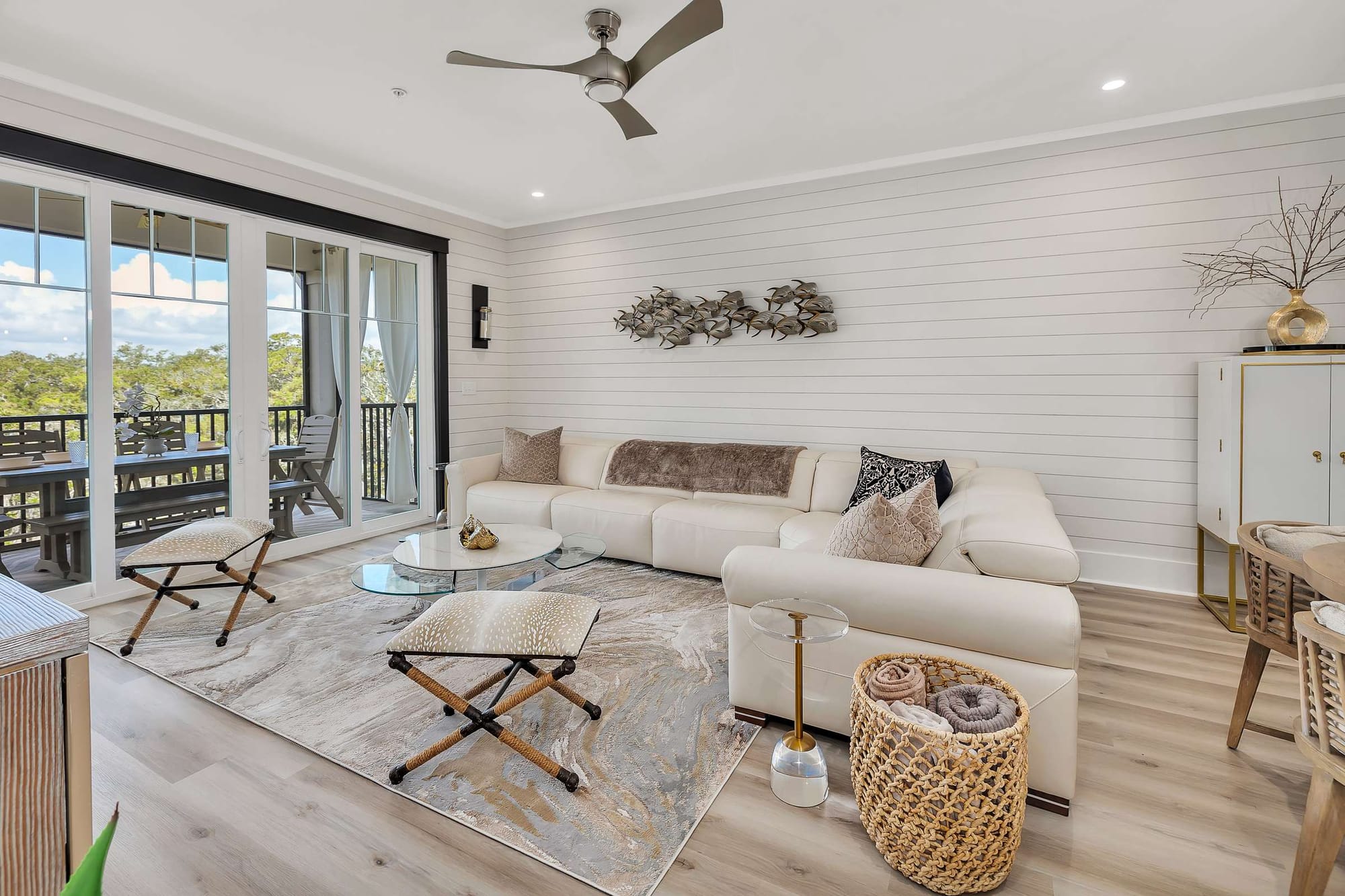 Modern living room with large windows.