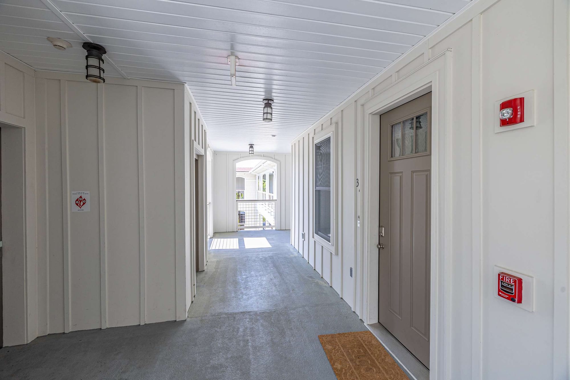 Bright apartment corridor with doors