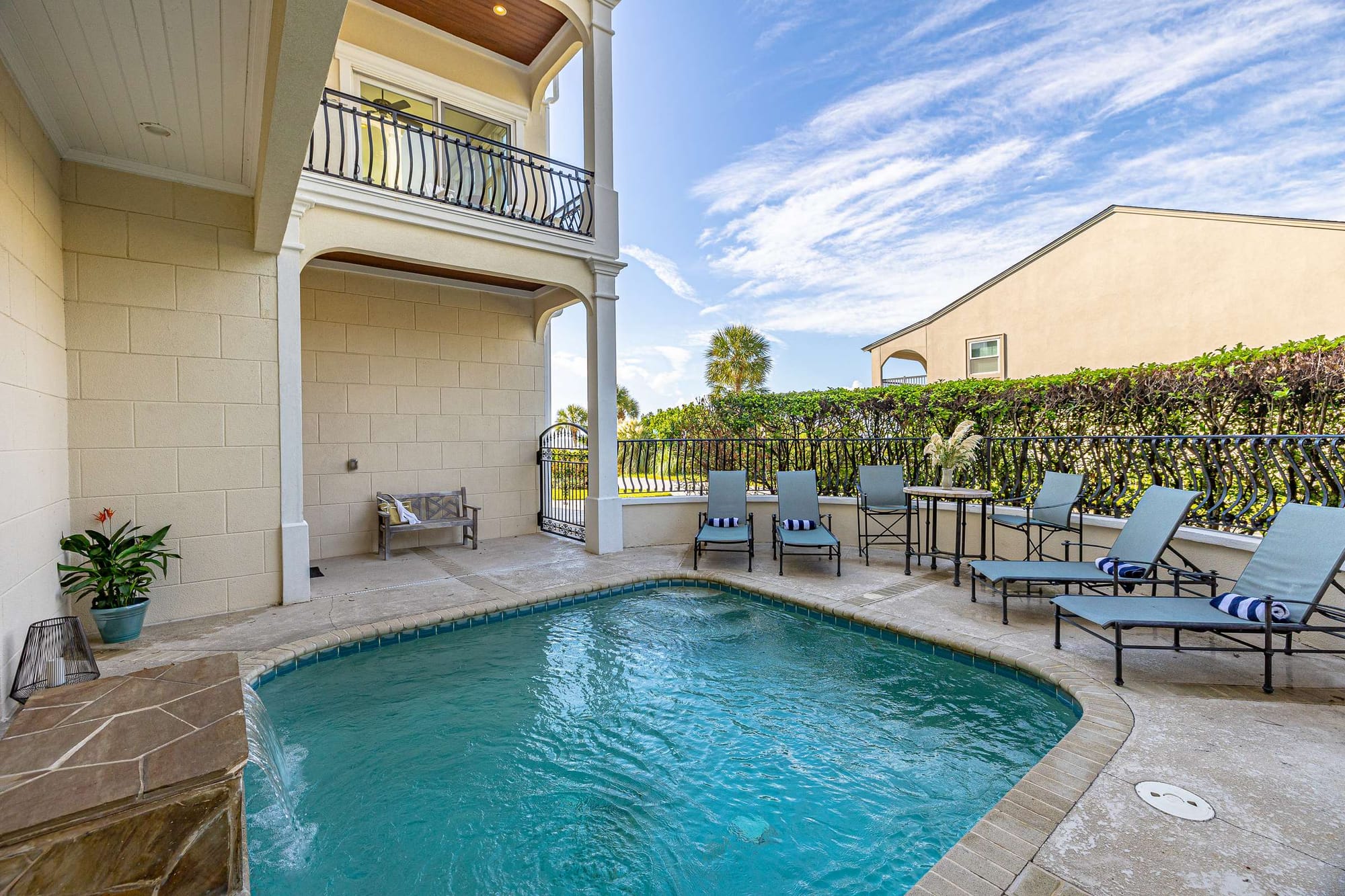 Outdoor pool with lounge chairs.