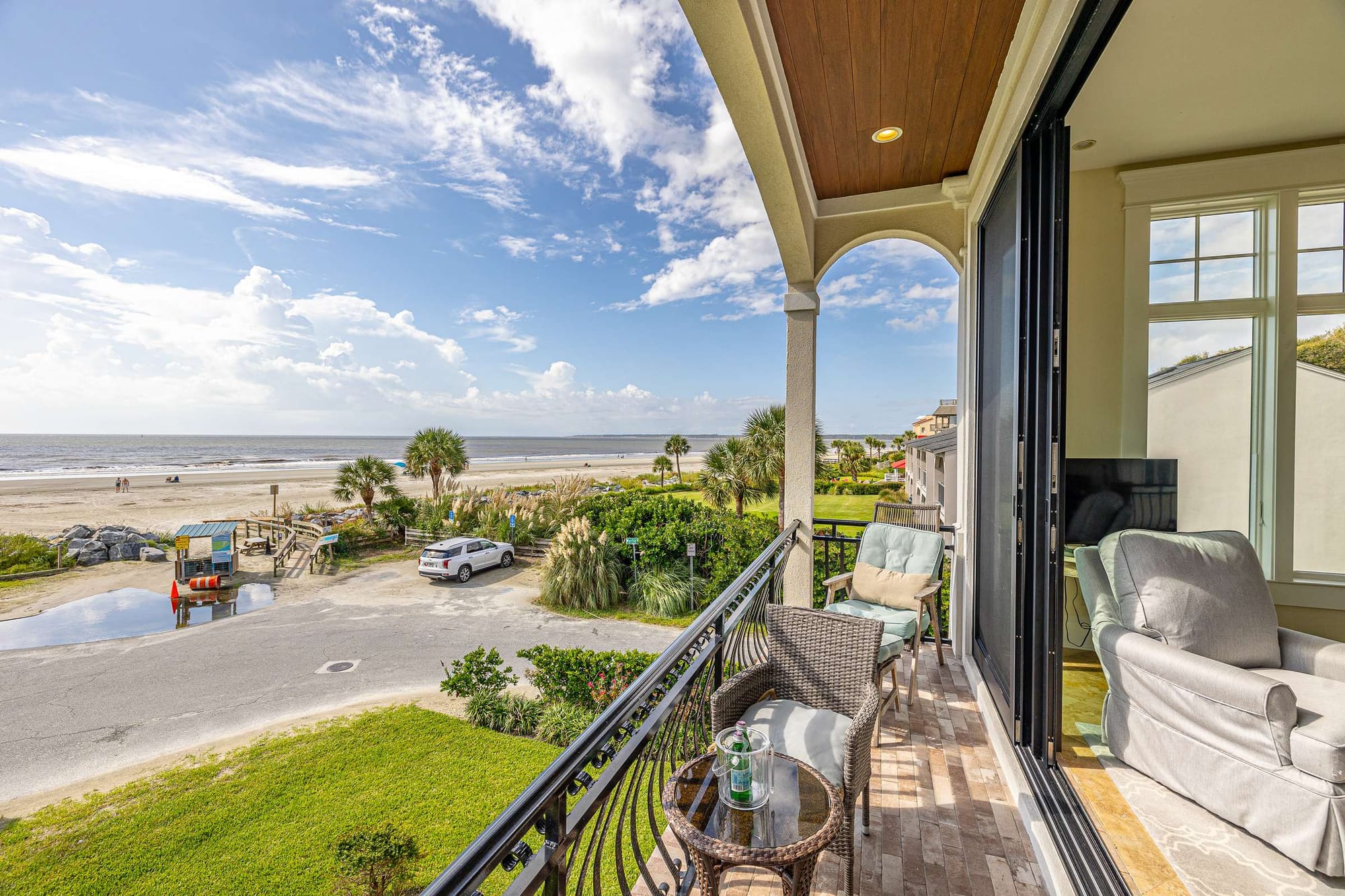 Balcony overlooking beach and ocean.