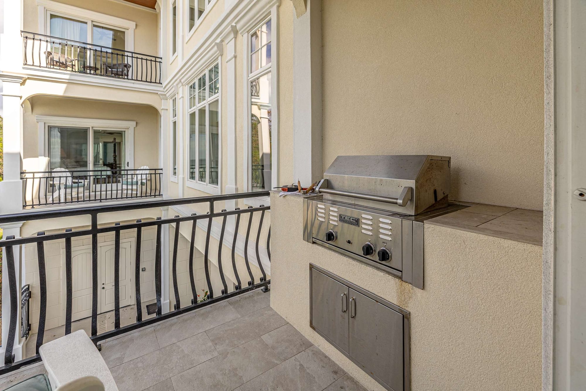 Balcony with built-in barbecue grill.