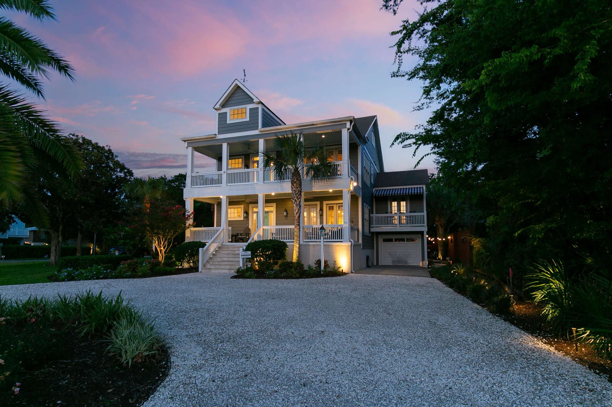 Two-story house with large porch.