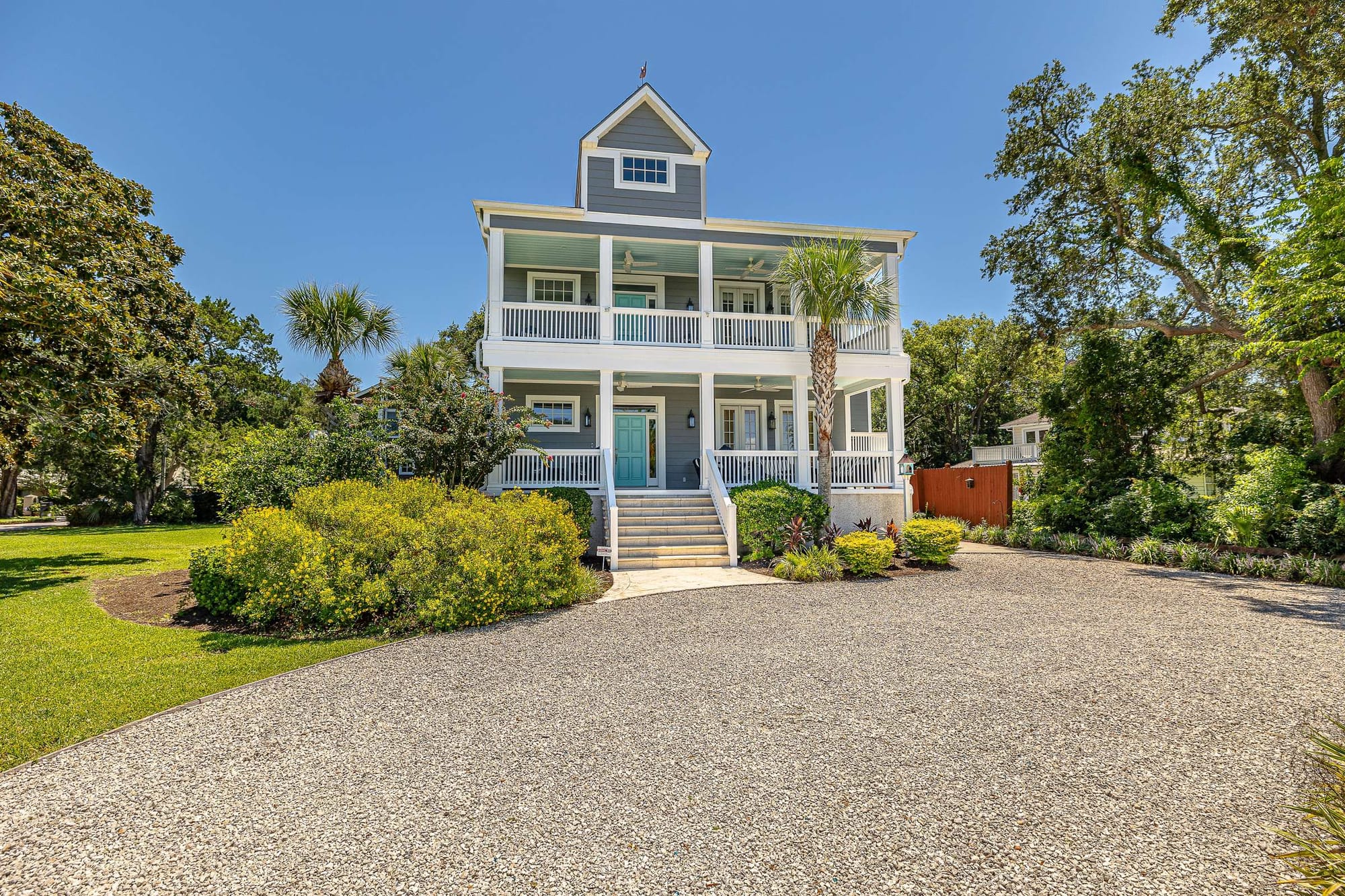 Two-story house with large porch.