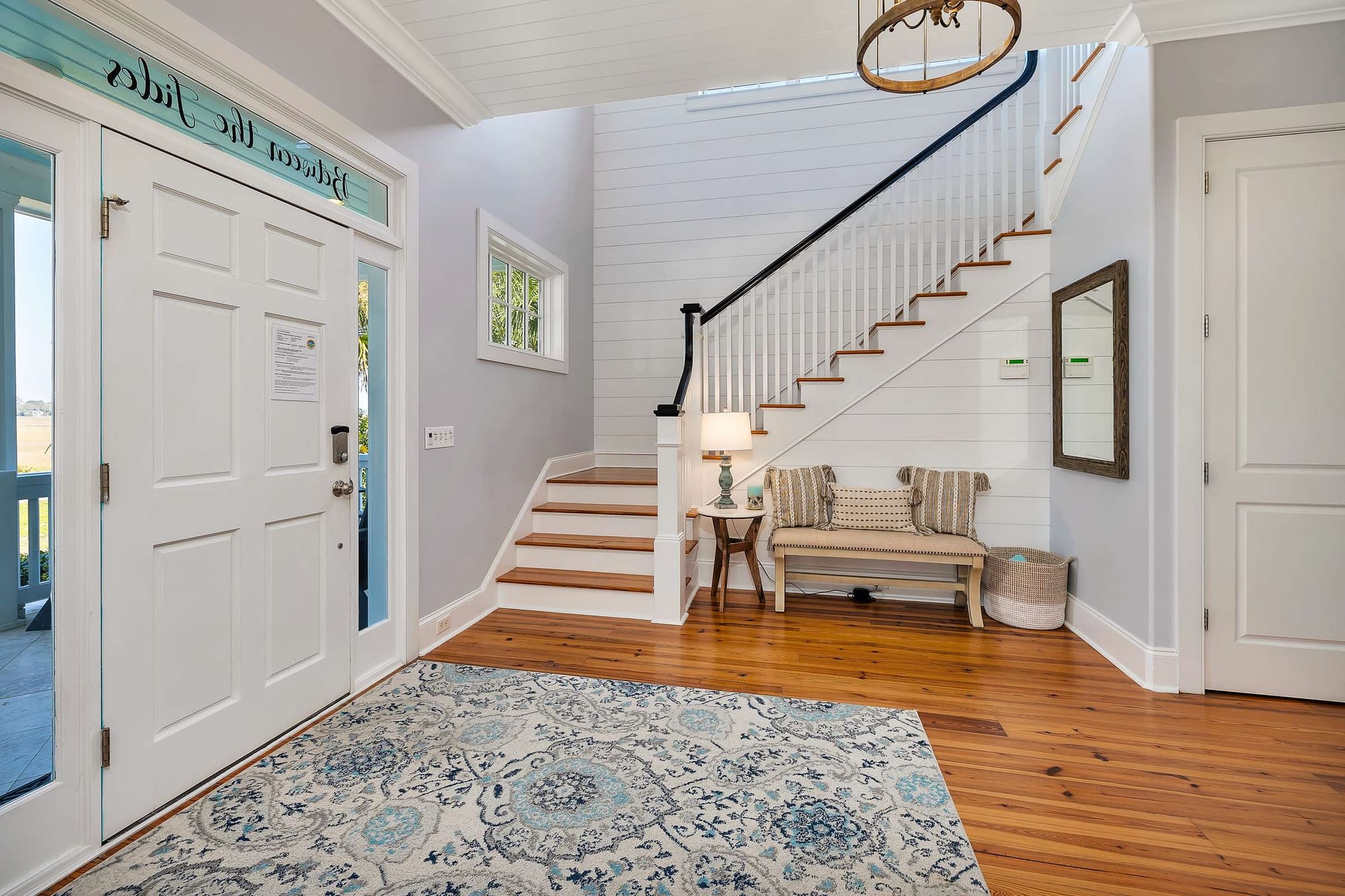 Bright entrance hall with staircase.