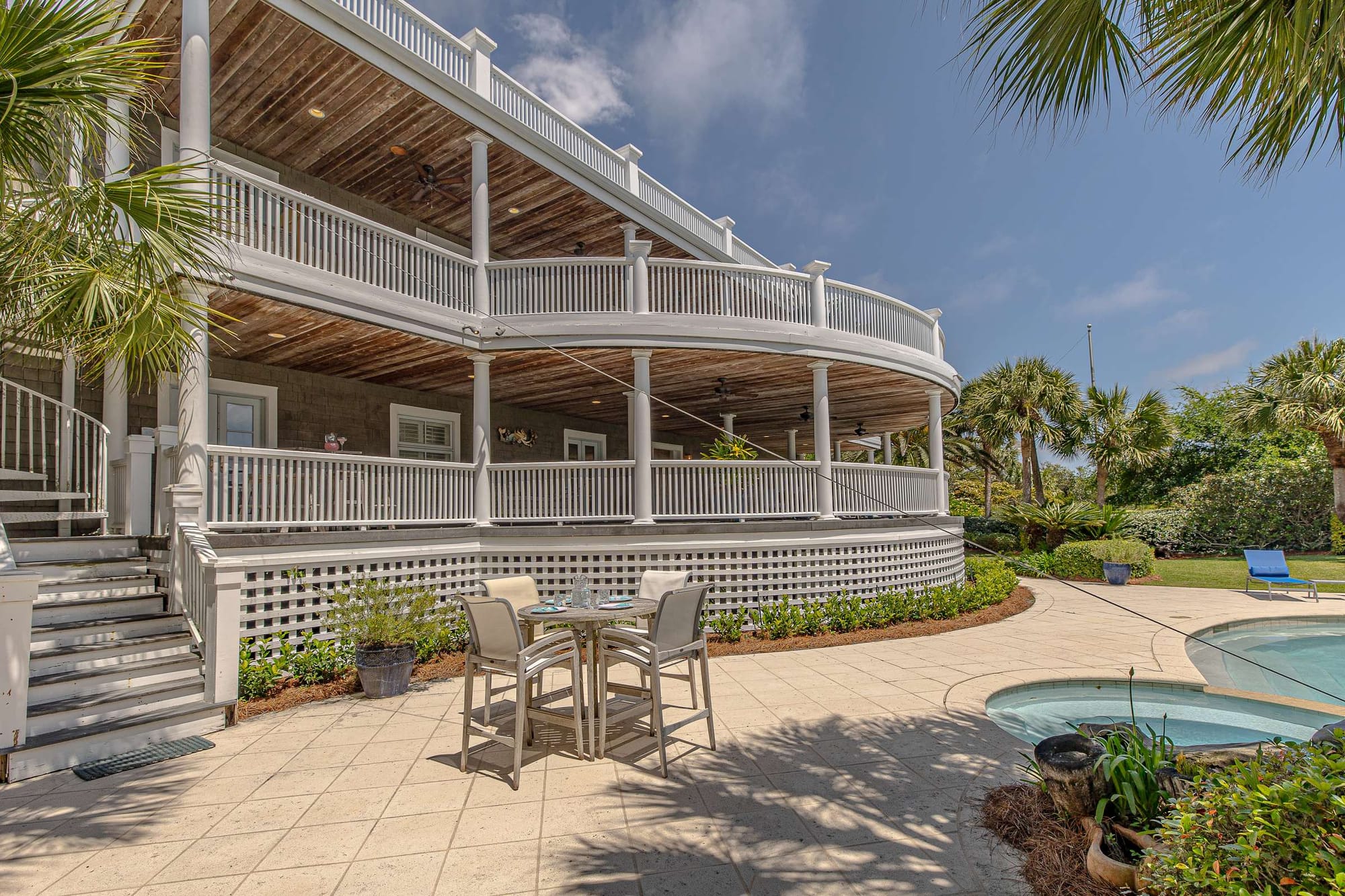 Large house with wraparound porch.