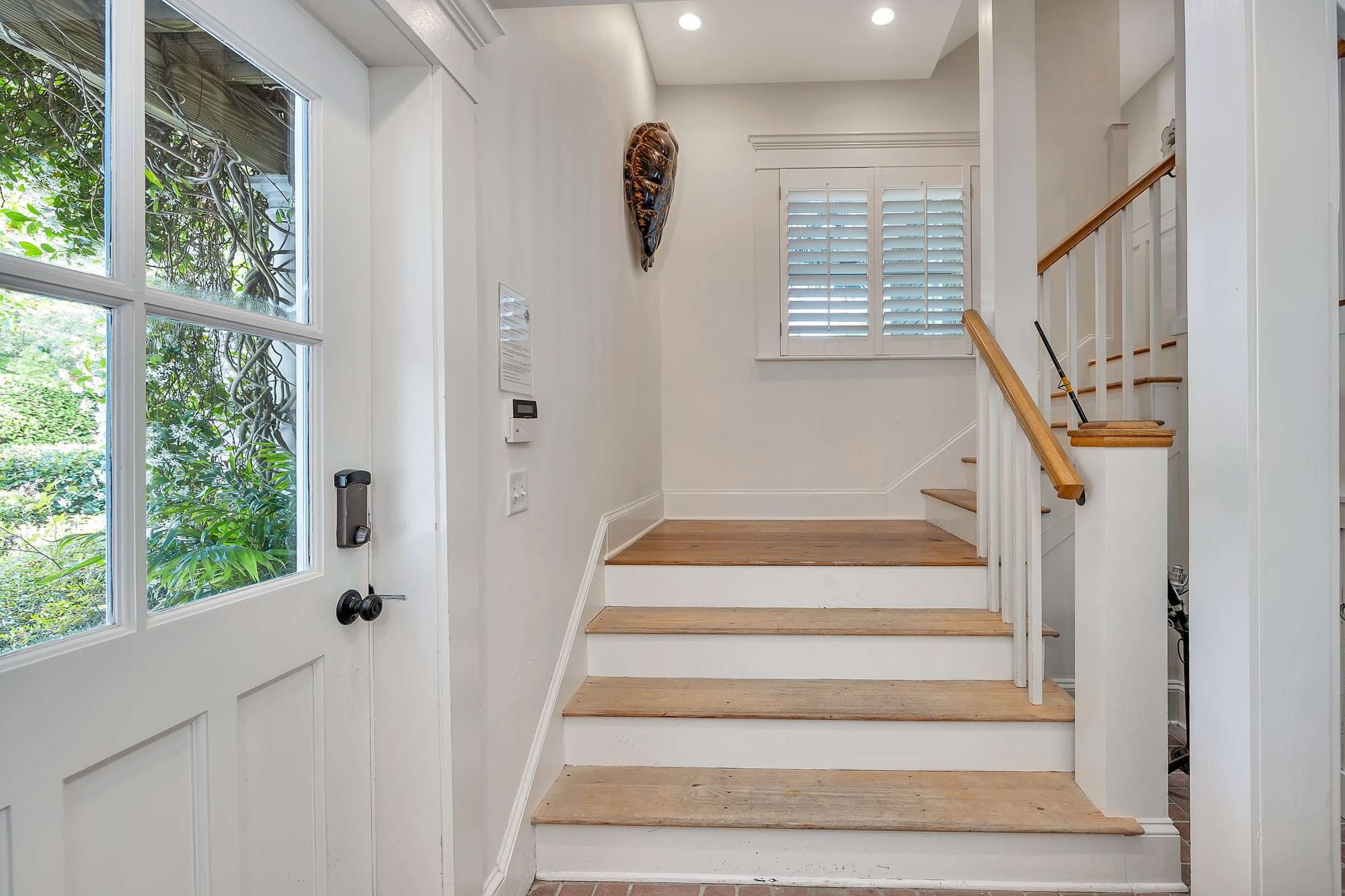 Staircase near glass-paned door.