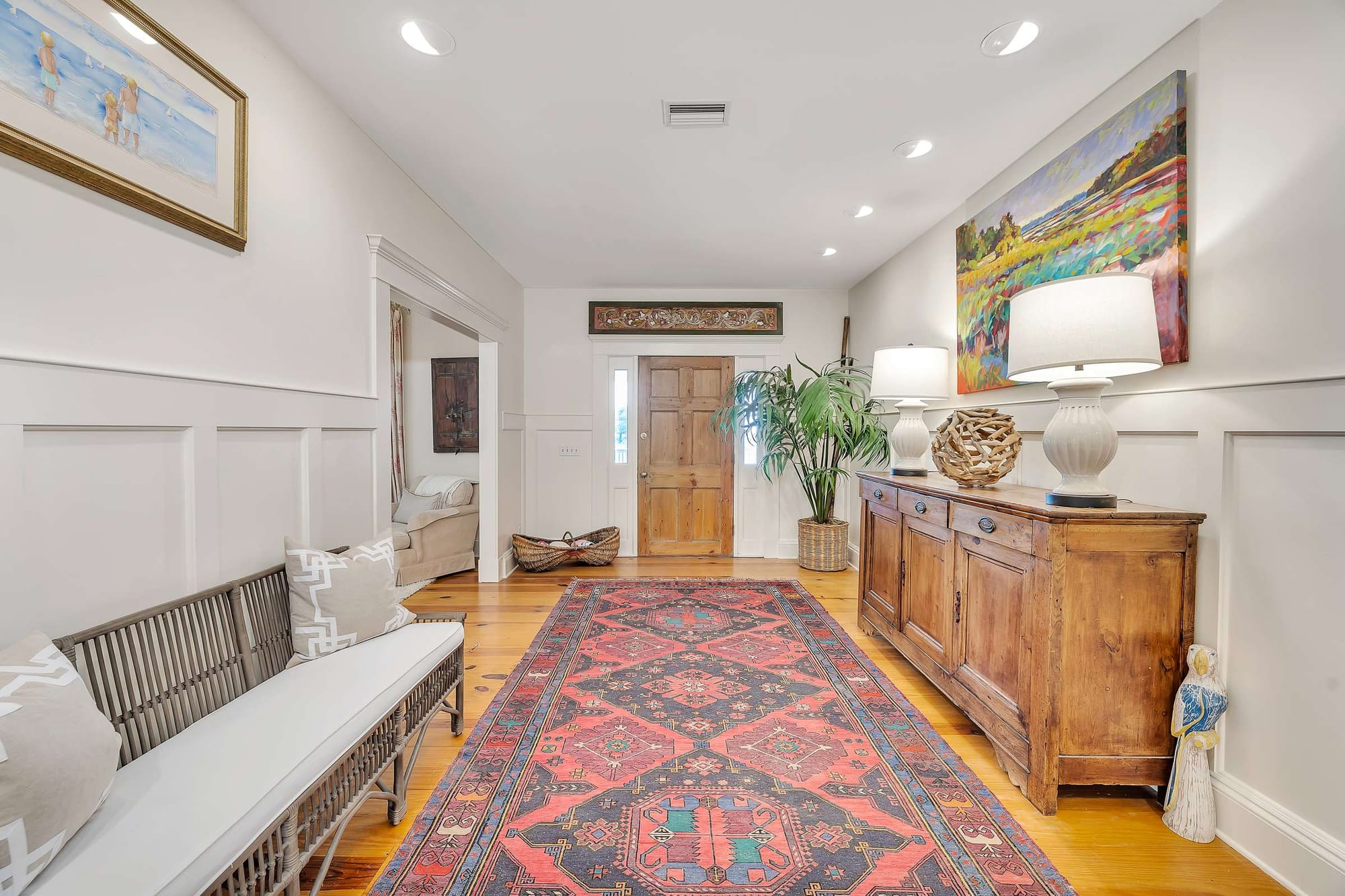 Hallway with rug and art decor