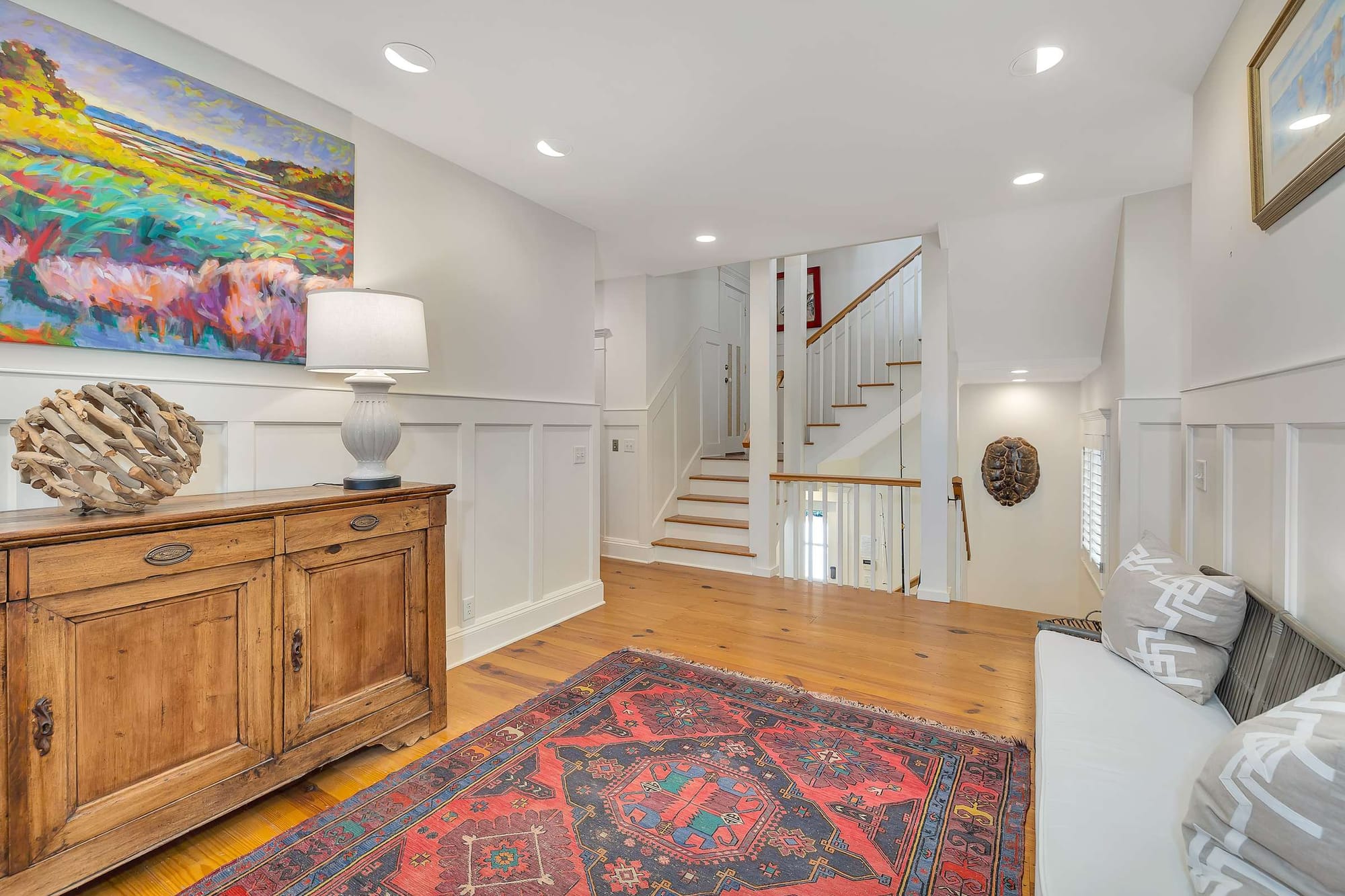 Home entryway with colorful rug.