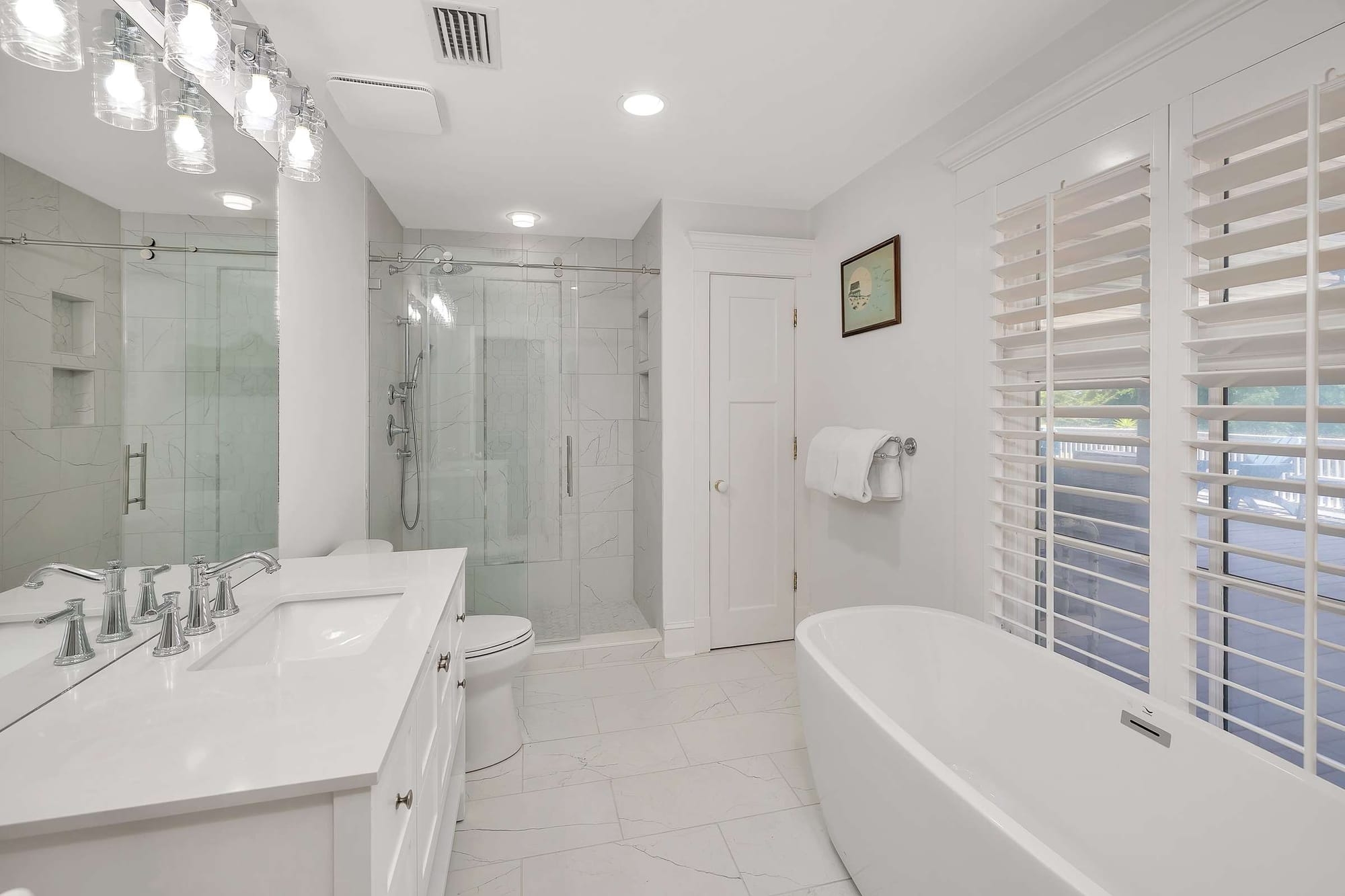 Modern bathroom with tub and shower.