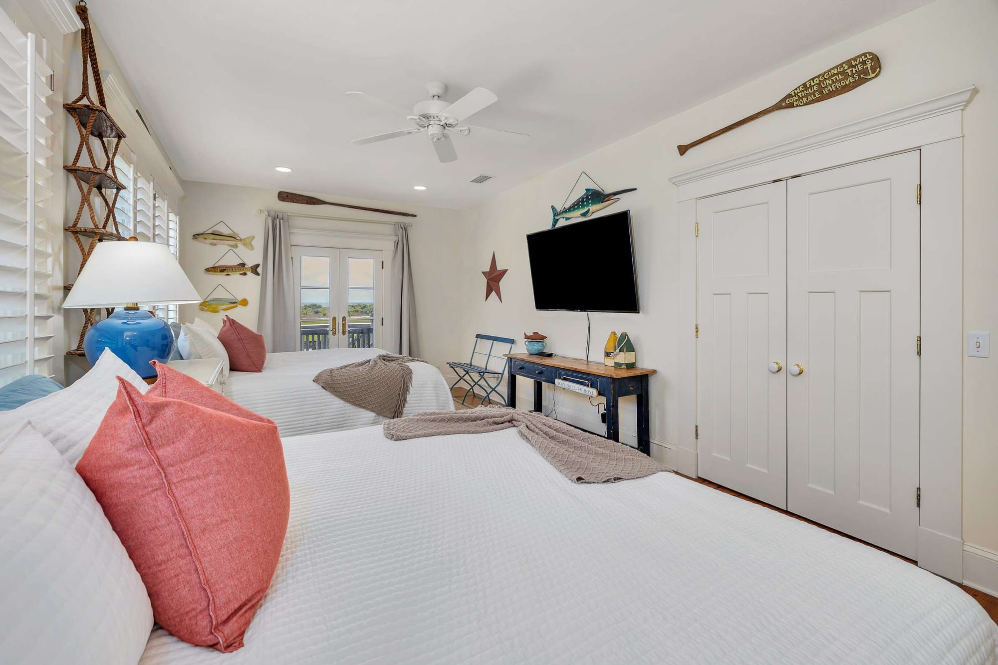 Coastal-themed bedroom with twin beds.