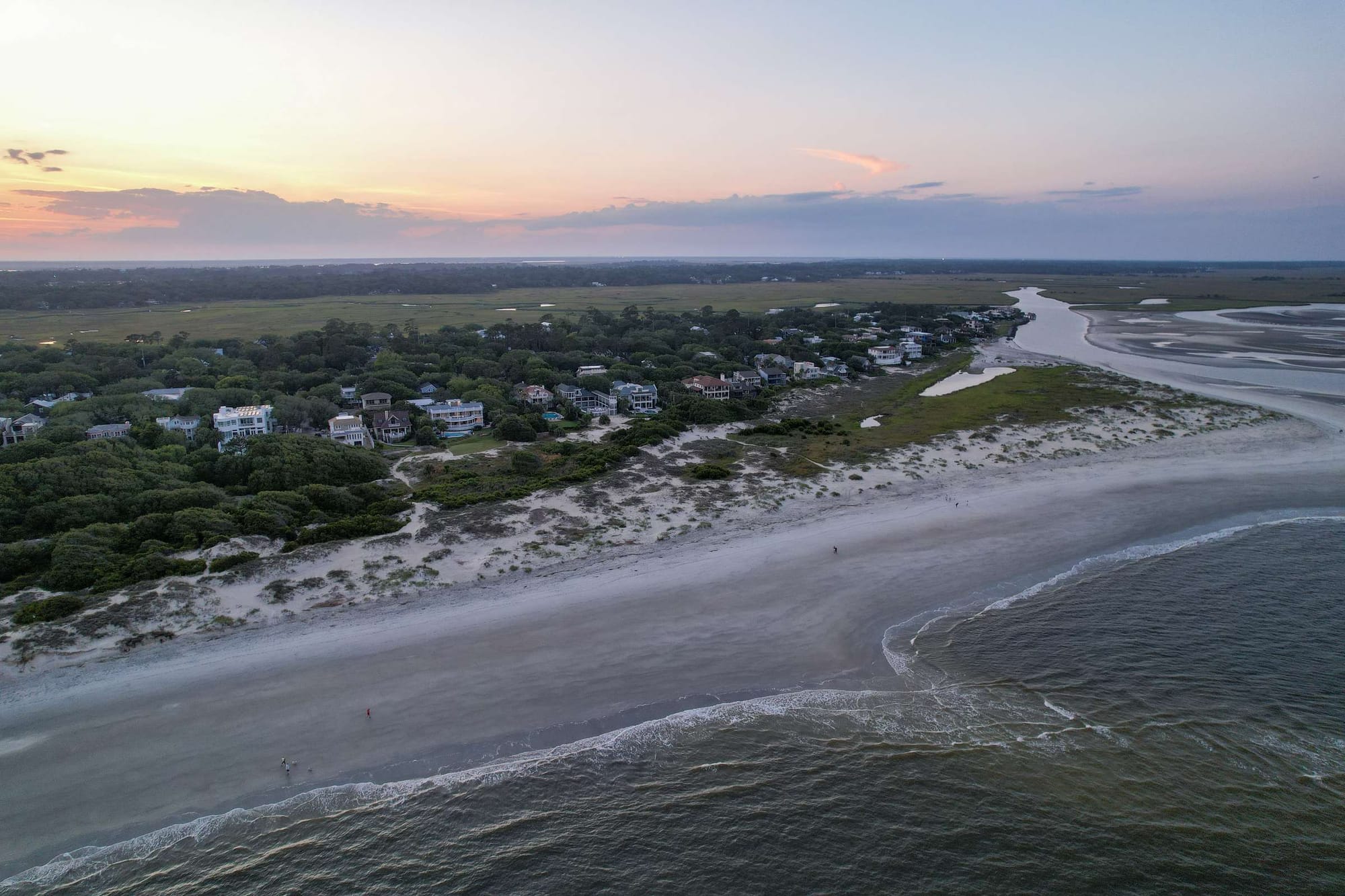 Beachfront houses at sunset aerial view