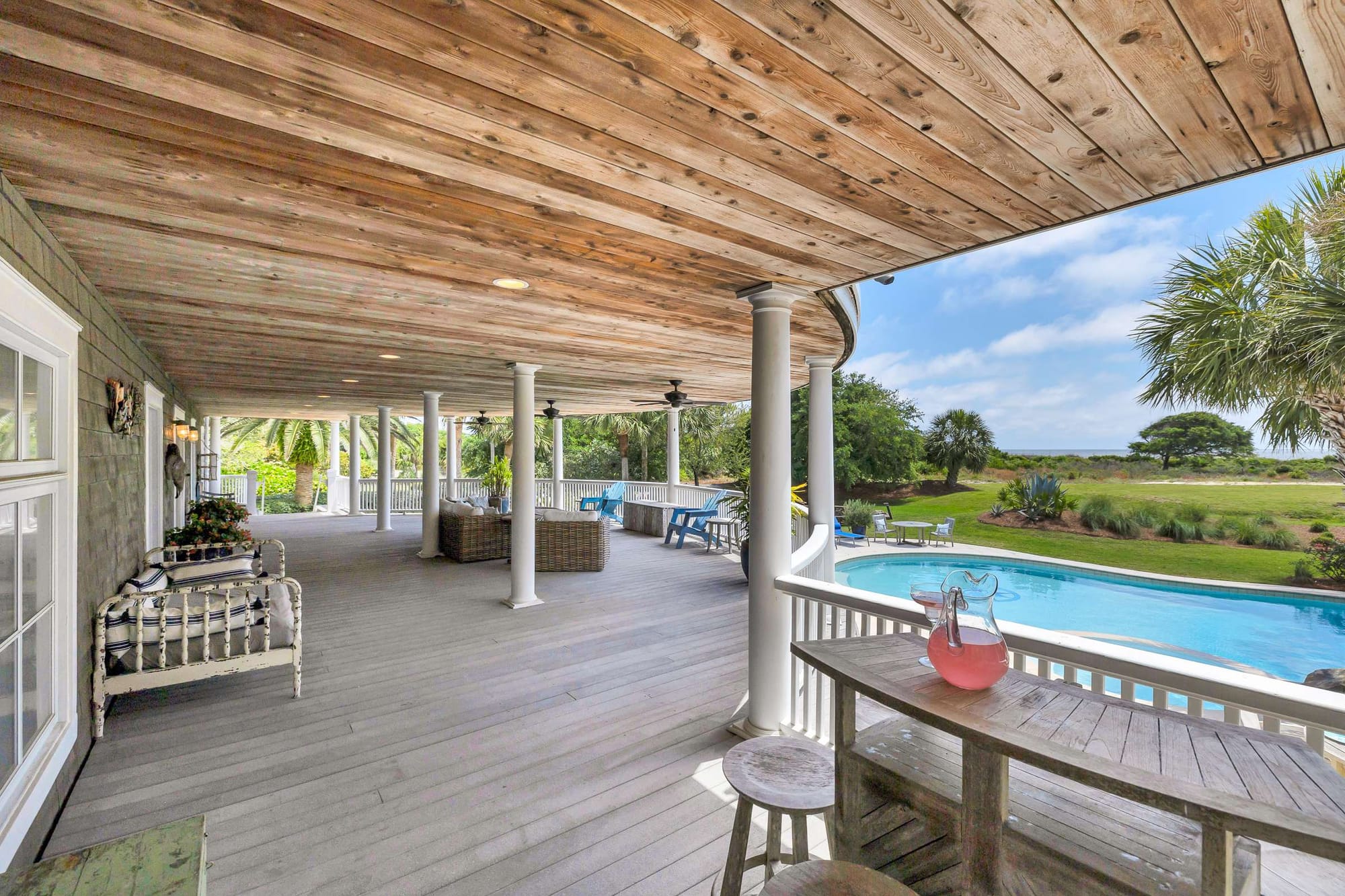 Covered patio with pool view.