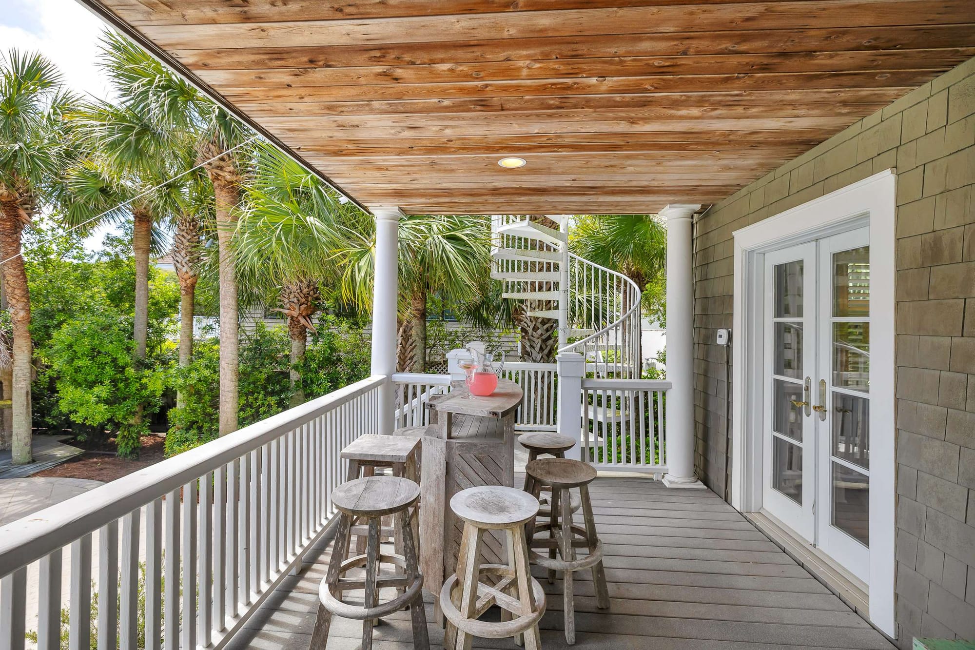 Cozy patio with spiral staircase.