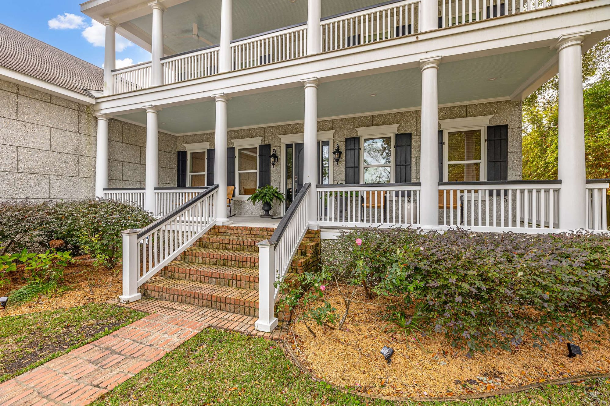 Two-story house with front porch.