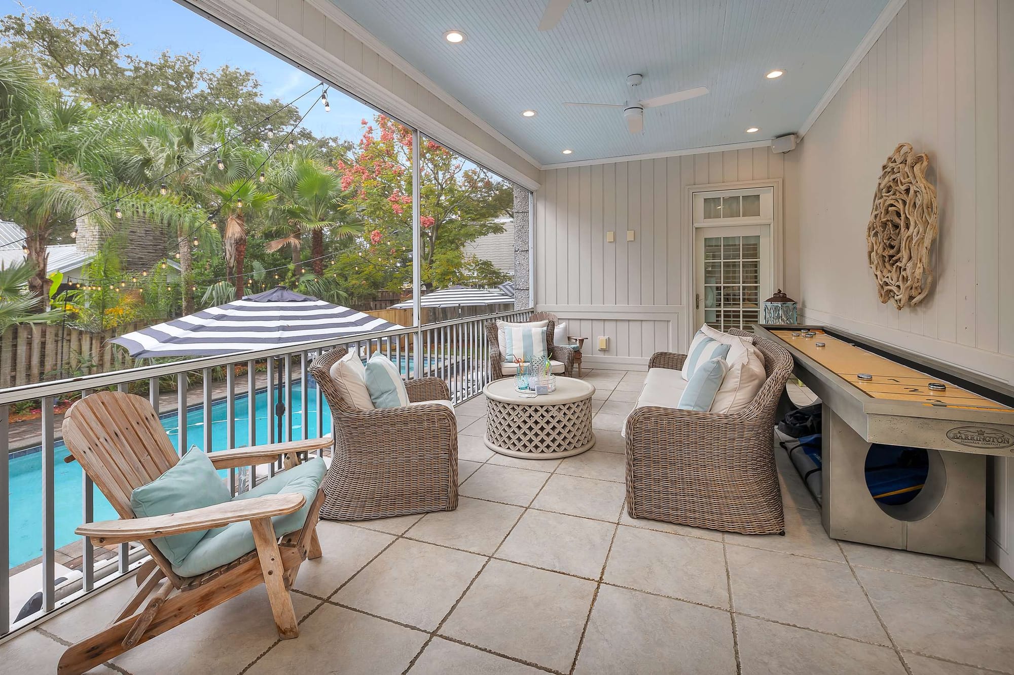 Outdoor patio with pool view.