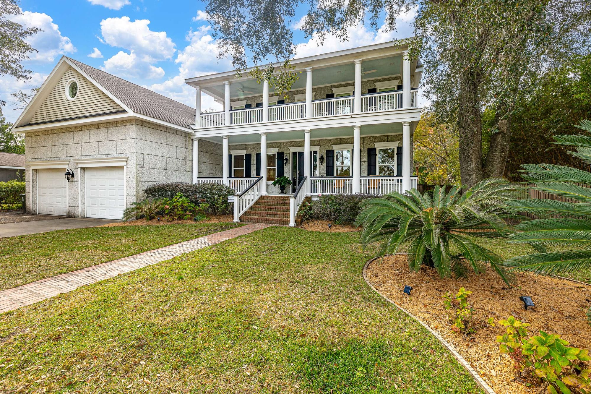 Two-story house with two garages.