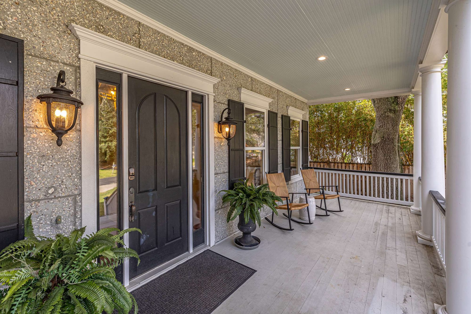 Charming front porch with rocking chairs.