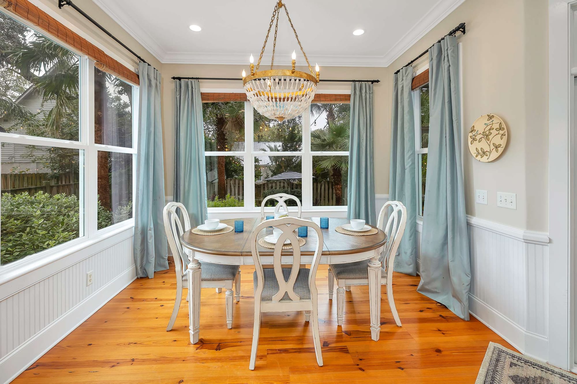 Bright dining room with round table.