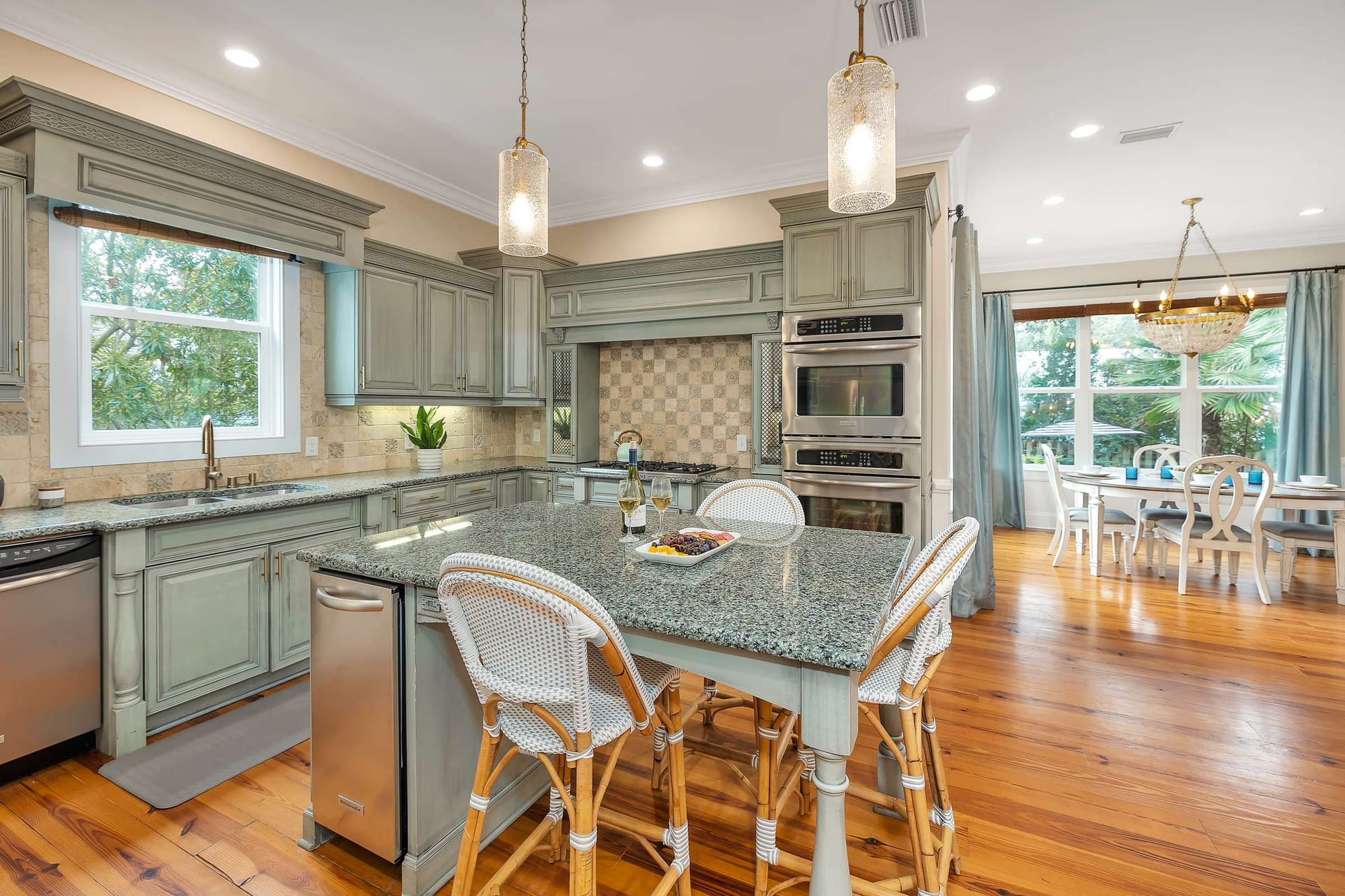 Elegant kitchen with island and dining.