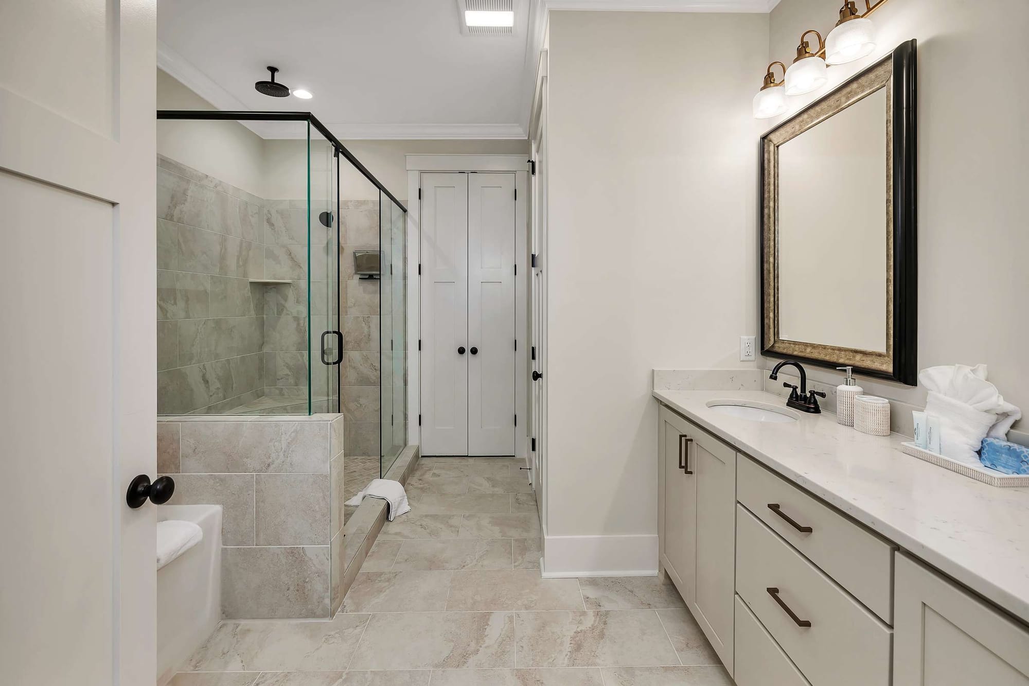 Modern bathroom with glass shower enclosure.