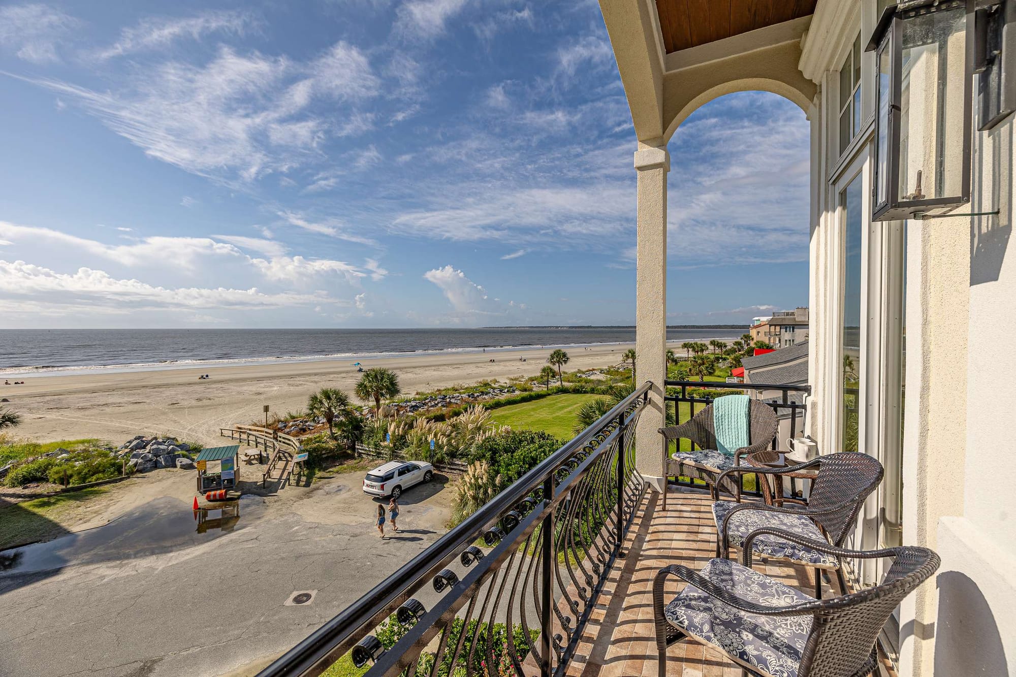 Balcony overlooking beach and ocean.