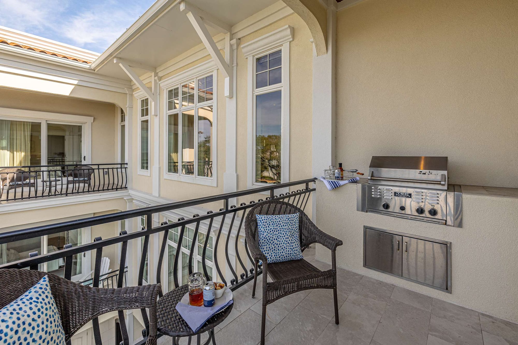 Balcony with grill and chairs