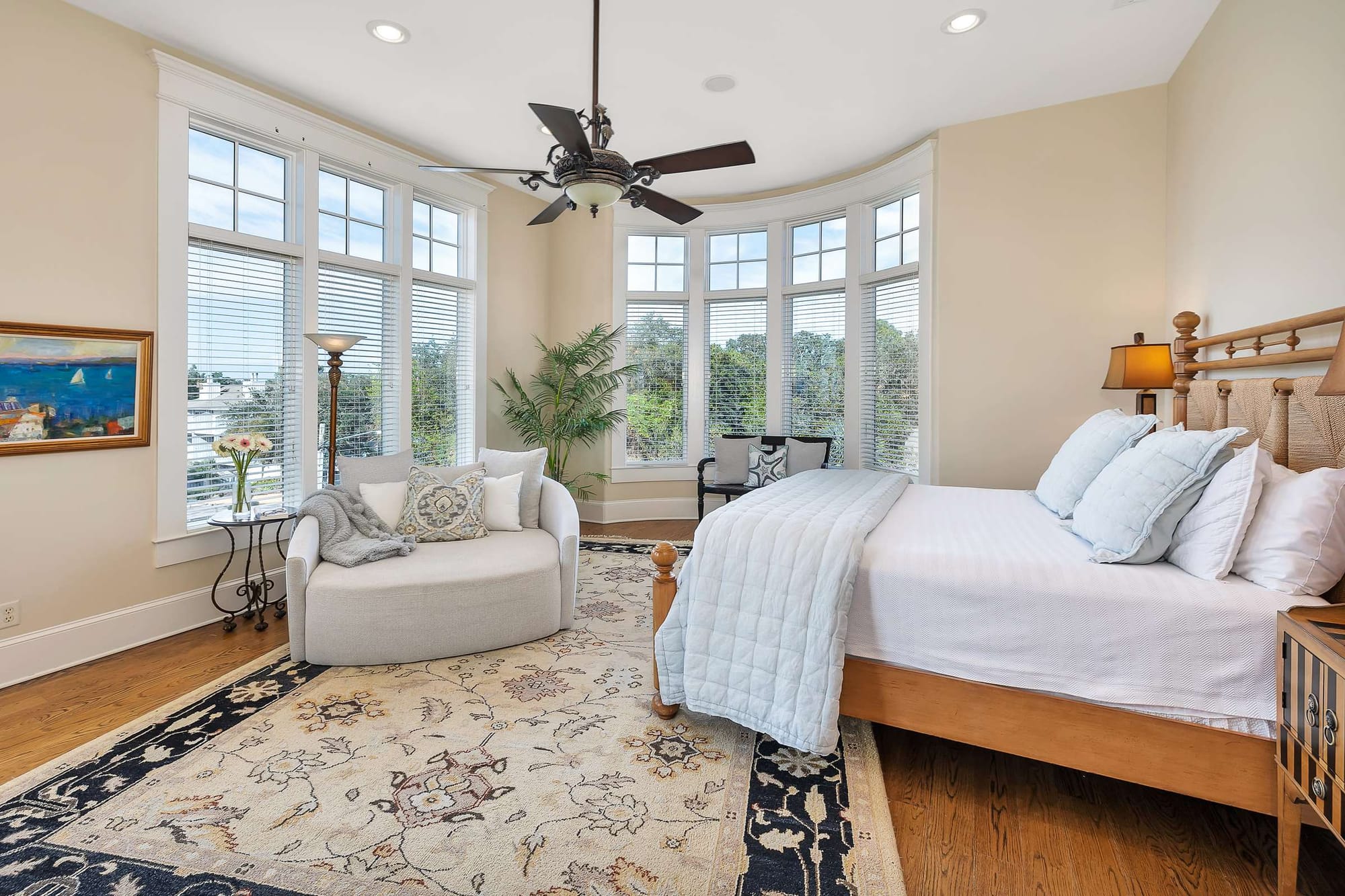 Bright bedroom with large windows.