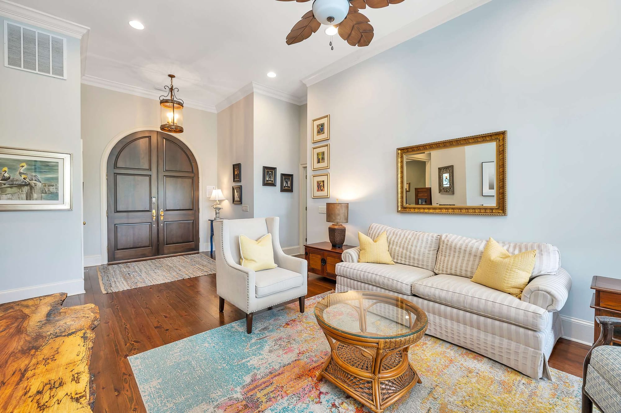 Cozy living room with arched door.