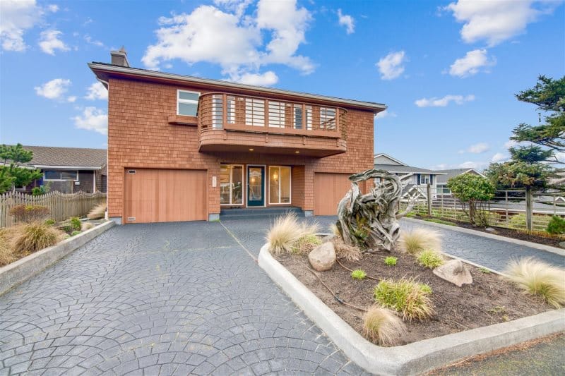 Two-story house with driveway.