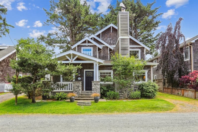 Charming two-story house with garden.