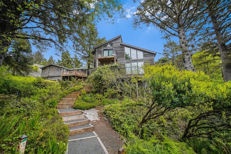 House surrounded by greenery and trees.