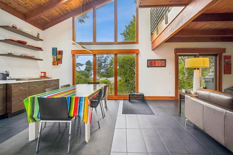 Modern dining area with large windows.