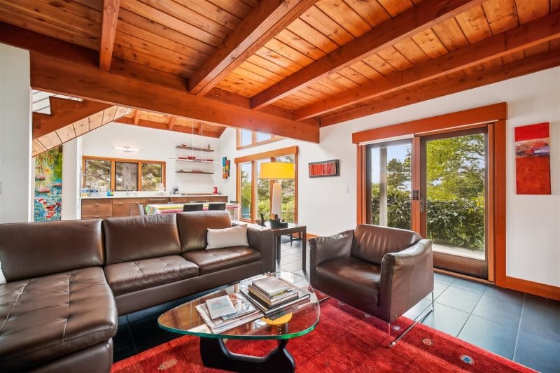 Modern living room with wooden beams.