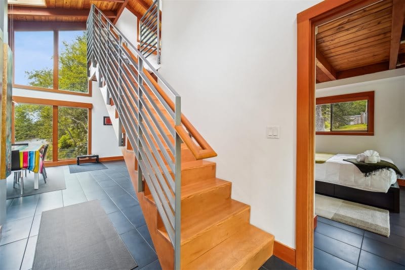 Modern interior with staircase and bedroom.