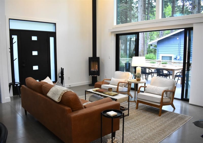 Modern living room with large windows.