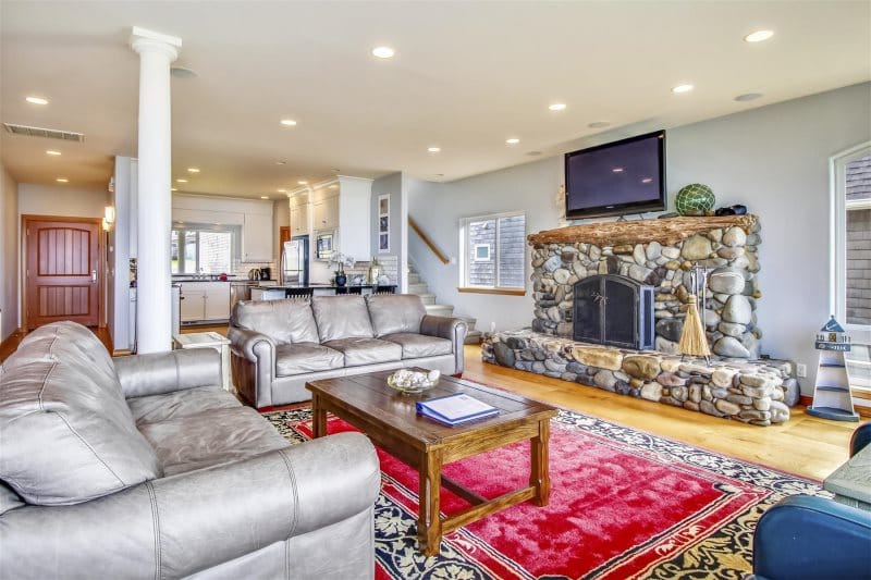 Cozy living room with stone fireplace.