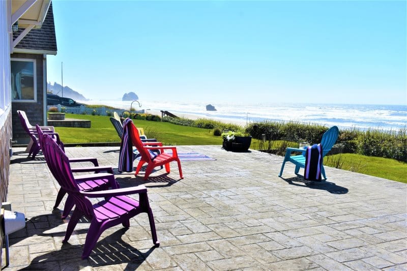 Colorful chairs on seaside patio.