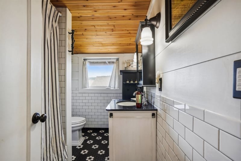 Rustic small bathroom with window.