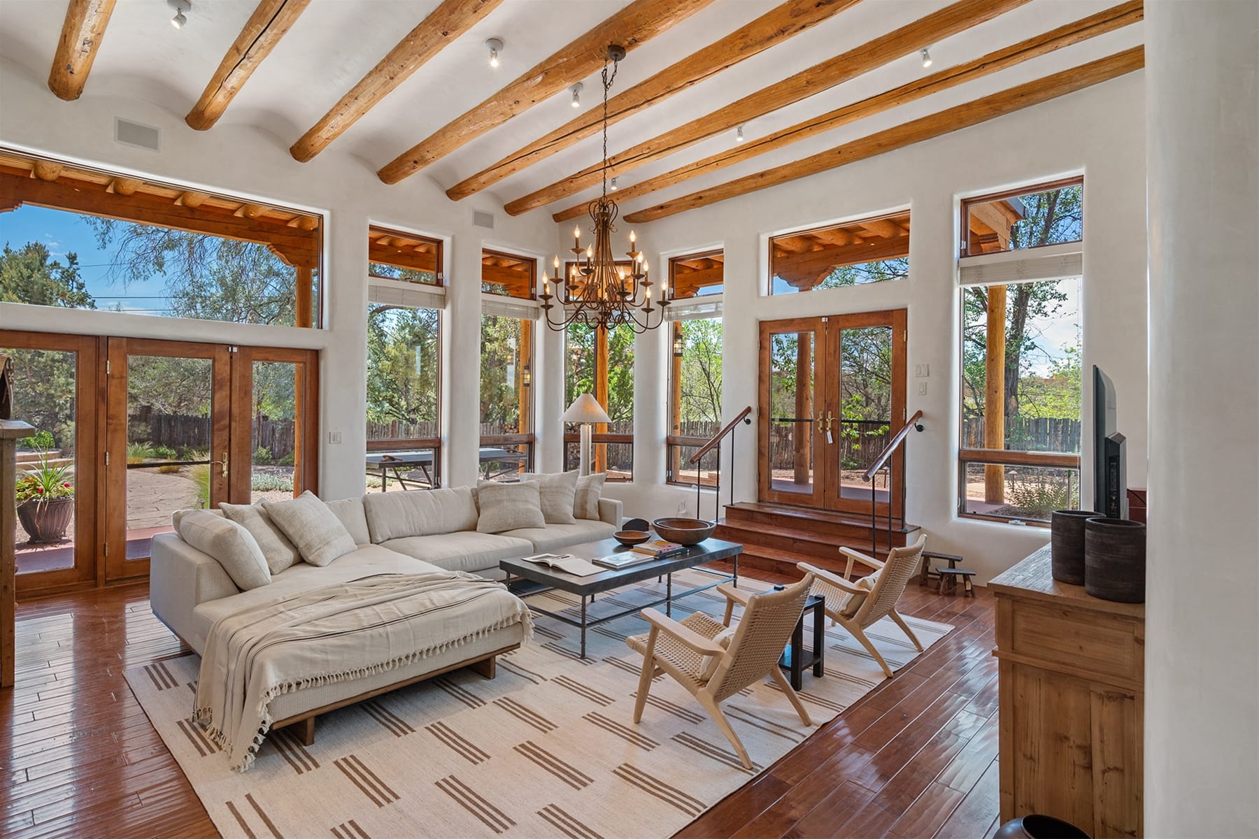 Rustic living room with large windows.