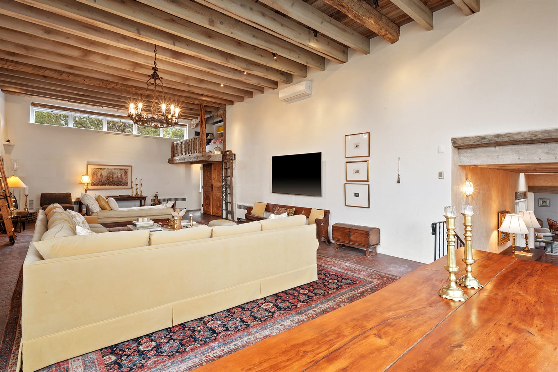 Cozy living room with wooden ceiling.