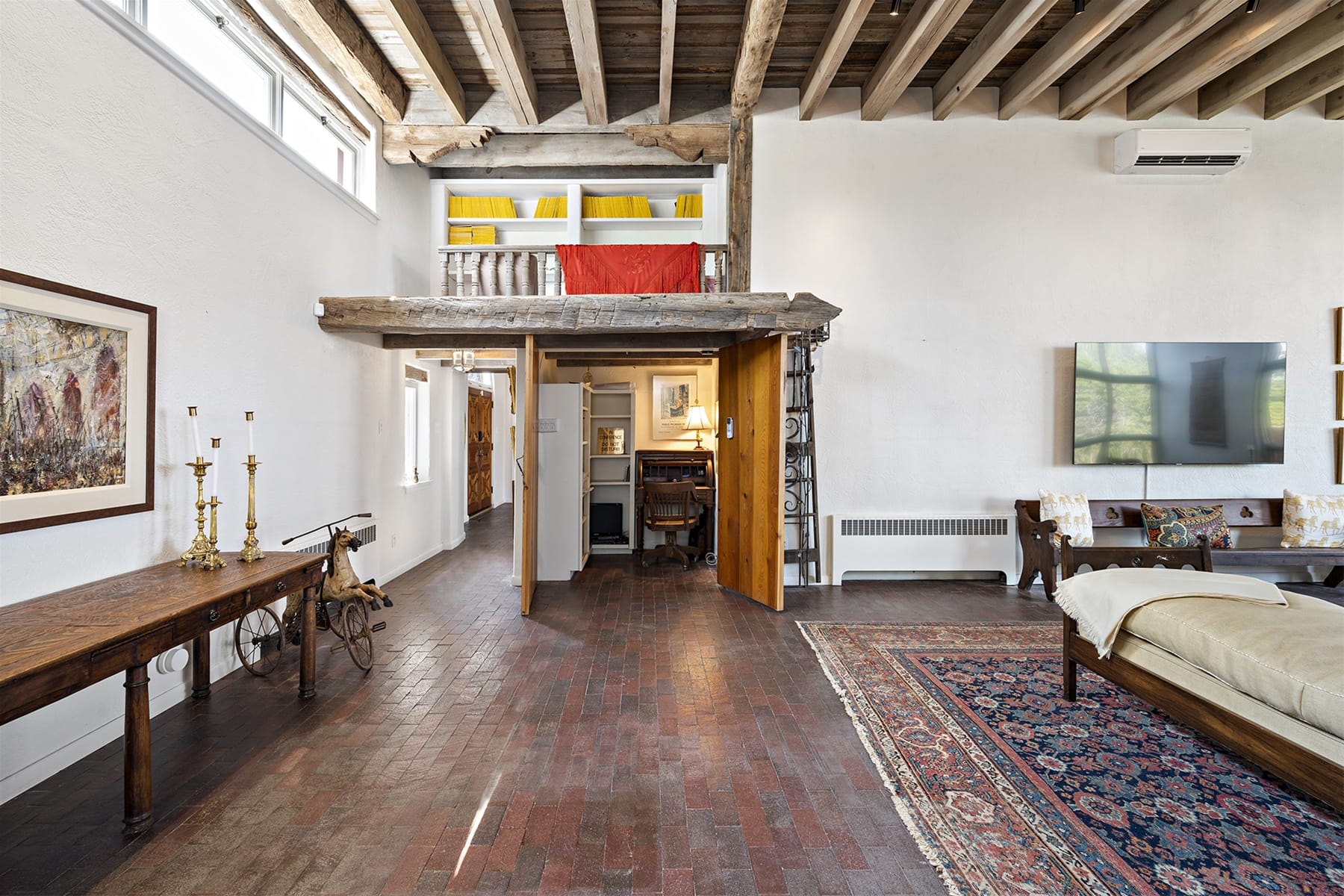 Rustic loft with exposed wood beams.