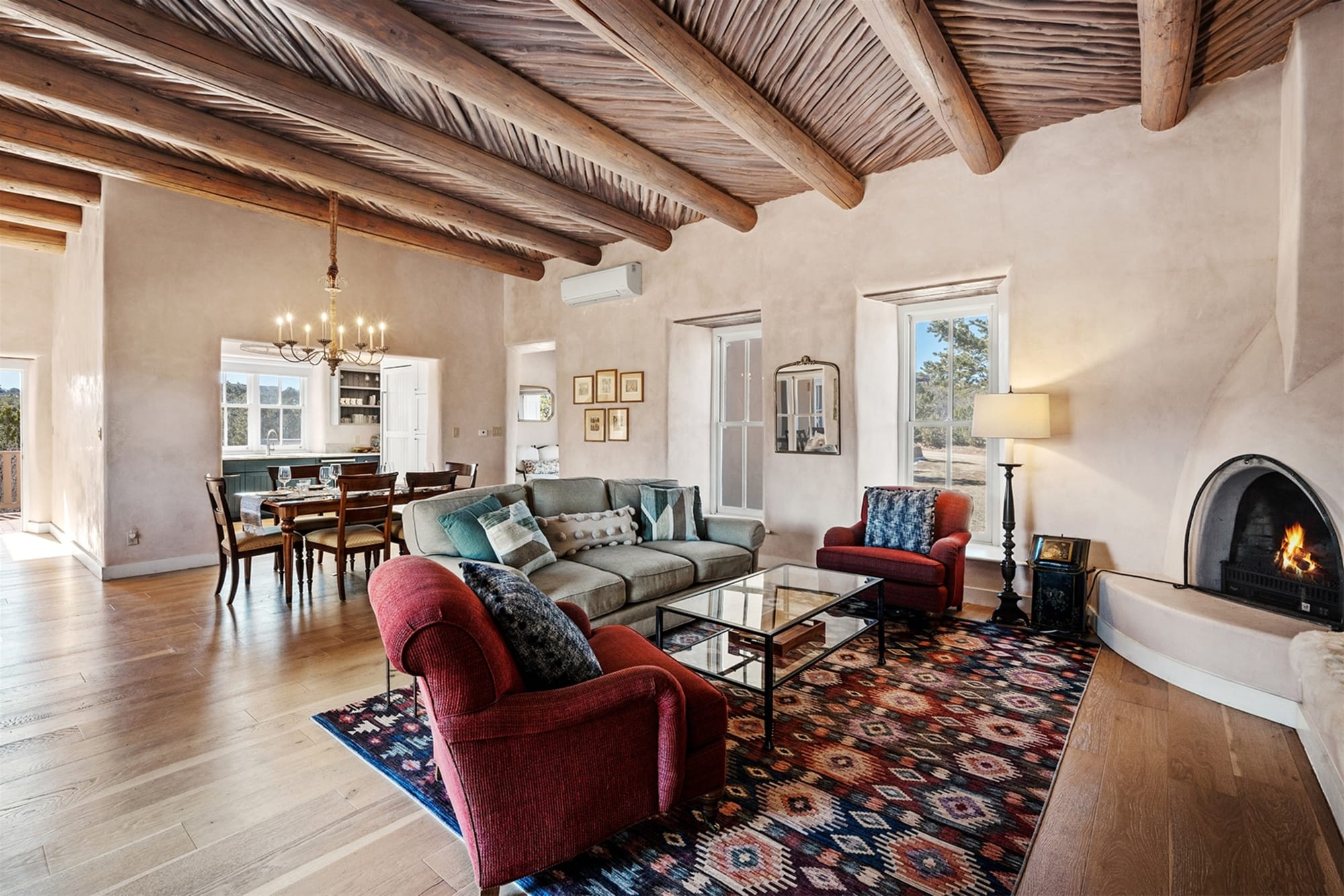 Rustic living room with wooden ceiling.