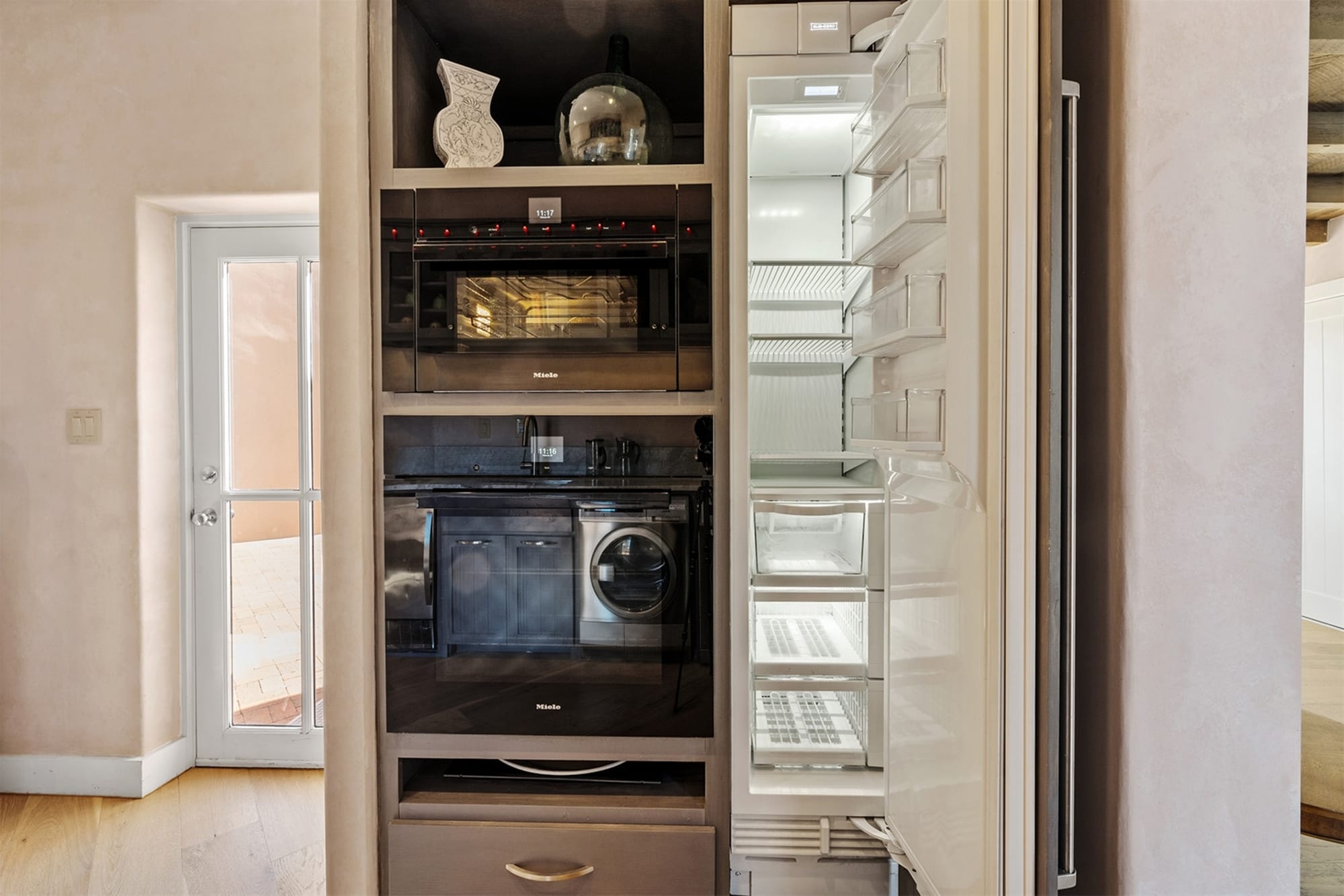 Modern kitchen with open refrigerator