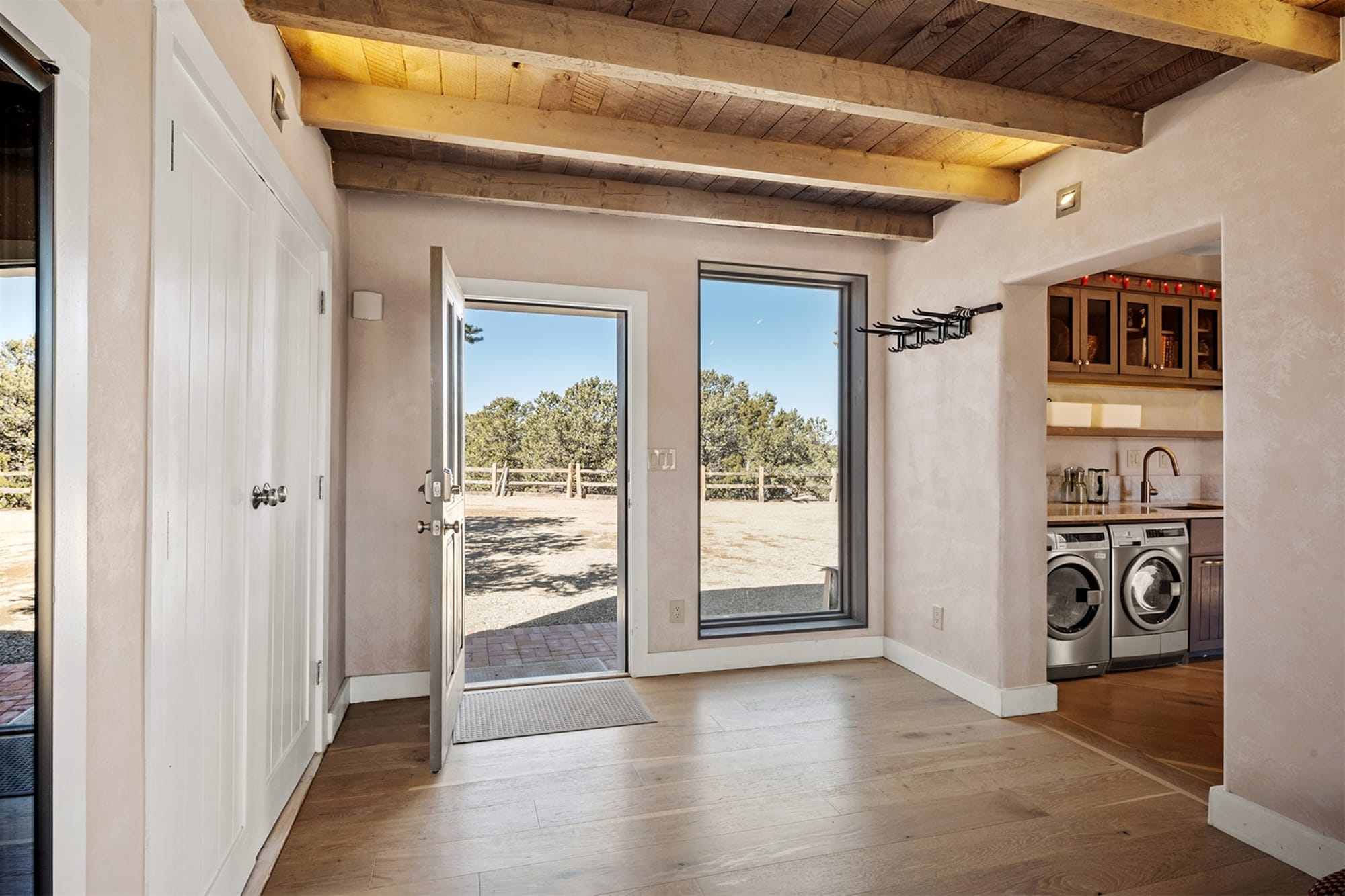 Laundry room with open door view